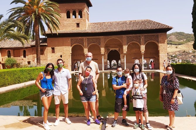 Alhambra, Generalife & Nasrid Palaces Guided Tour in Granada - Alhambra grounds: from monumental palace-city to ordered highlights