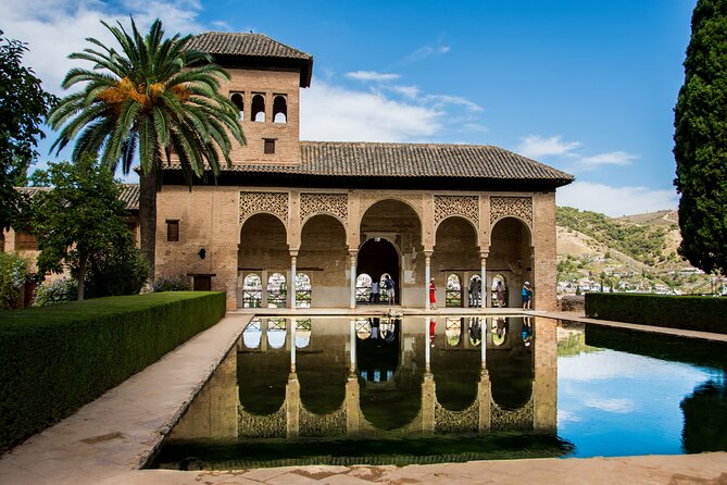Alhambra Tour and Nazaries Palaces with Hammam Massage Experience - Entering the Alhambra complex with a guide (and headsets that actually help)