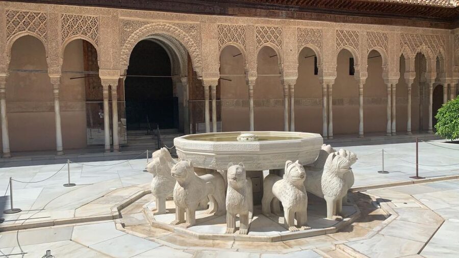 Granada: Alhambra Guided Tour w/ Nasrid Palaces & City Pass - Getting around Granada with bus rides (and one tourist-train ride)