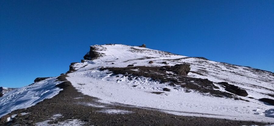 Granada: Sierra Nevada Veleta Peak Trek with Lunch - Winter snowshoes vs summer walking sticks: the gear that changes the day
