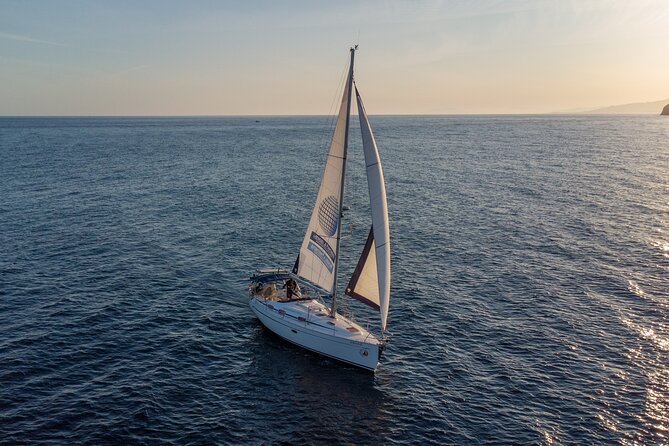 Sailing at sunset along the cliffs of Maro-Compartida - Where Maro-Compartida makes this sail feel special